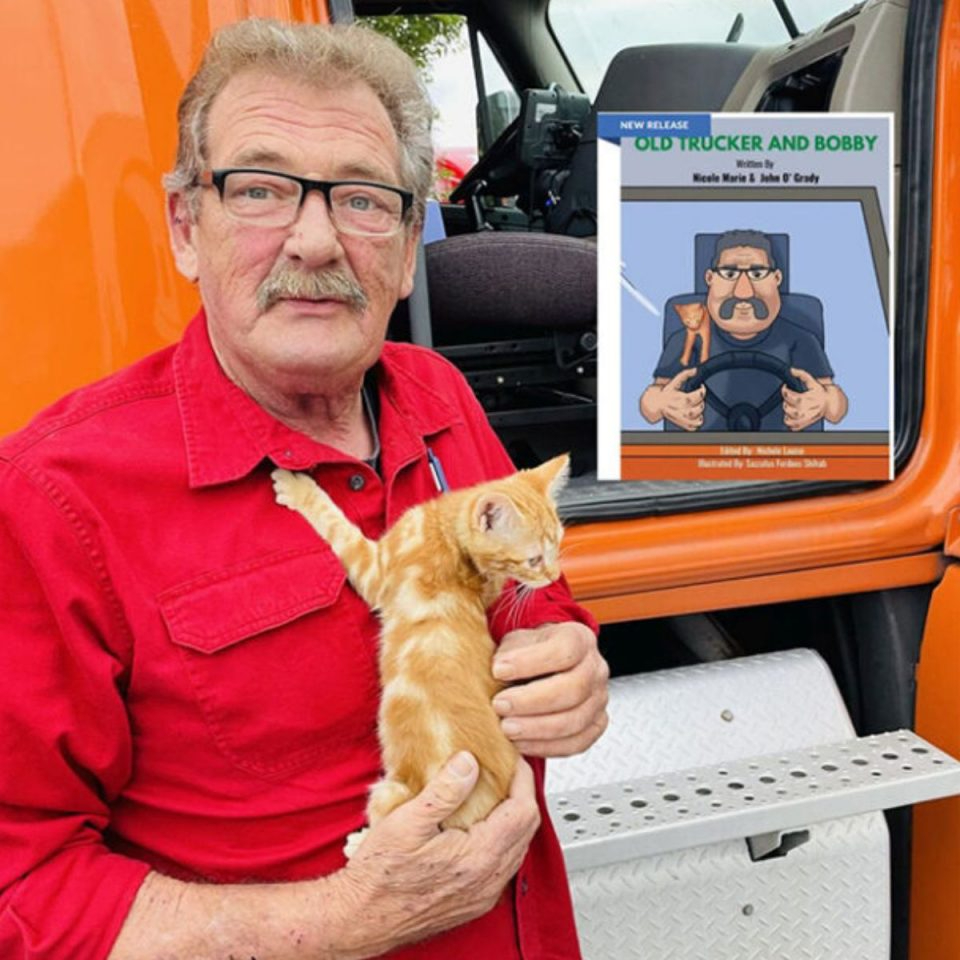 Lastwagenfahrer und seine orangefarbene Katze